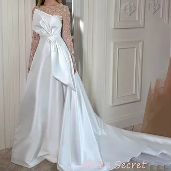Свадебное платье из тюля трапециевидной формы с круглым вырезом, длинными рукавами и карманами-бантиками, с высоким разрезом, длиной до пола, со шлейфом для часовни
